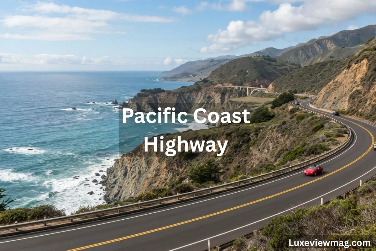 The Pacific Coast Highway, highlighting a winding road with stunning ocean views and rugged coastal landscapes.