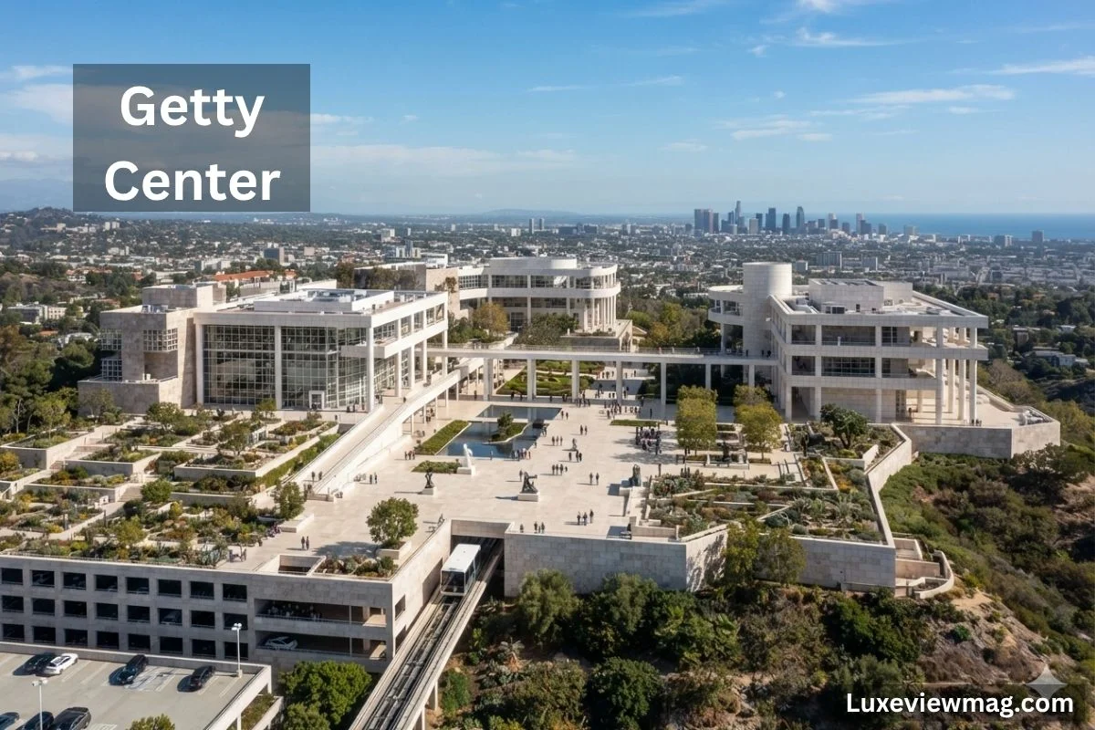 The Getty Center in Los Angeles, California, showcasing modern architecture and beautiful gardens against a clear blue sky.