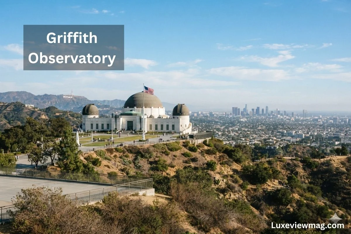 Griffith Observatory in Los Angeles, showcasing its iconic architecture against a clear blue sky.