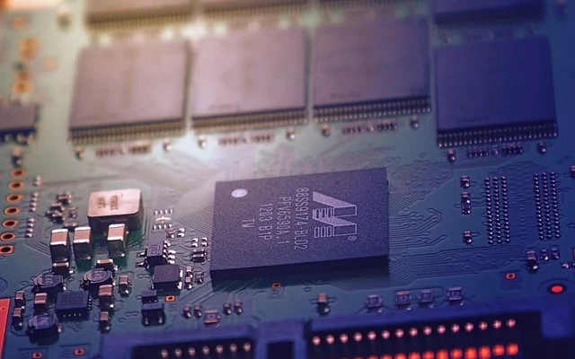 A close-up view of a Rdatao computer motherboard displaying intricate circuitry and components.