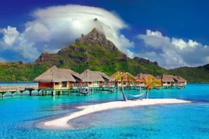 A stunning view of Bora Bora, showcasing its turquoise waters and lush landscapes near the baoase luxury resort​.
