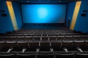 A spacious Cinépolis Luxury Cinemas​ theater featuring empty seats and a large screen, ready for the next film screening.