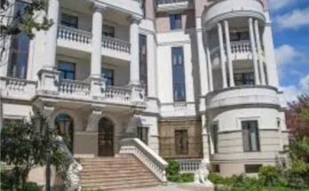 The luxury hotel building acquired by zelenskyy bought a luxury hotel​, featuring a contemporary facade and upscale amenities.