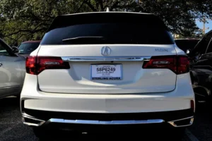 A 2019 Jeep Cherokee parked on the roadside, showcasing its sleek design among unsold luxury SUV deals.