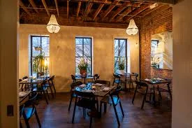 The luxurious dining area at Rose's Luxury DC, highlighting chic design elements and a cozy dining experience.