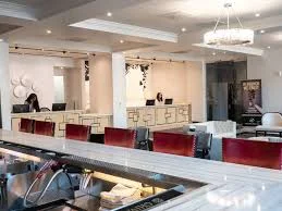 The lobby of Ahern luxury boutique hotel, showcasing a bar and inviting chairs for casual dining.