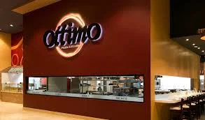 Ahern Luxury Boutique Hotel's Ottimo Restaurant features a prominent sign and a stylish bar area.