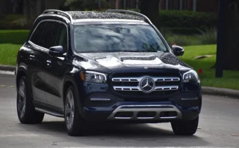A Mercedes GLS luxury SUV navigating a street, highlighting its elegant style and performance as a best luxury small suv​.
