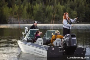 Several individuals on a boat engaged in fishing, surrounded by water and clear skies, showcasing a recreational veneajelu outing.