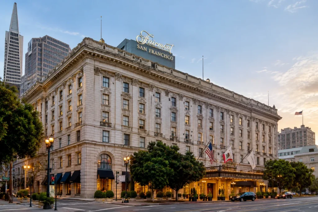 The Fairmont San Francisco hotel, featuring its grand facade and iconic entrance amidst the urban landscape.