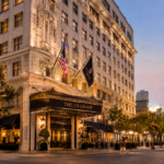 The US Grant Luxury Hotel in San Diego with historic architecture and illuminated entrance