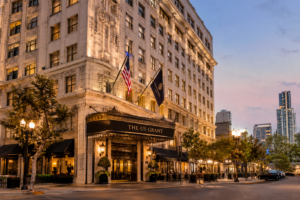 The US Grant Luxury Hotel in San Diego with historic architecture and illuminated entrance